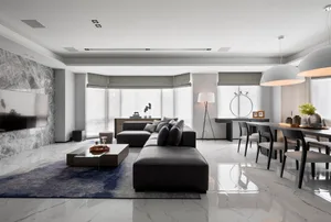 Modern living room with marble floor, furniture, and decor.