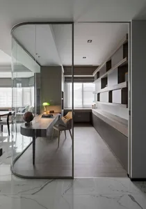 Contemporary office space featuring glass cabinets and sleek modern design elements.
