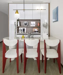 A modern dining room with white furniture and a sleek design.