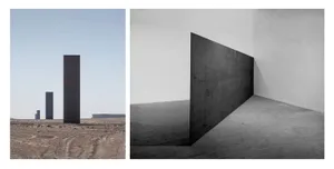 A minimalist installation featuring a large black metal panel within a white-walled room.
