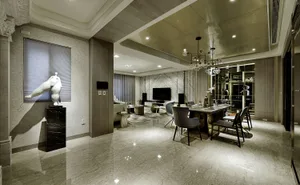 A modern living and dining room featuring marble flooring and materials.