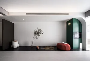Modern living room featuring a minimalist design with concrete flooring and a sleek, contemporary aesthetic.