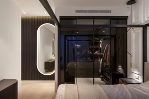 Modern interior design featuring a glass closet with a sleek black frame.