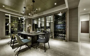 Modern dining room featuring a marble table, glass chandelier, and wooden chairs.