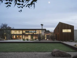 A modern house exterior featuring a wooden exterior.