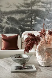 A modern living room with natural, textured elements and a cozy atmosphere.