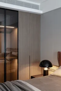 Modern minimalist bedroom featuring wood and glass materials.