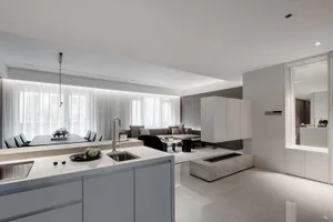 Modern minimalist living room with concrete elements and white curtains.