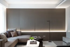 Modern minimalist living room featuring metal panels and contemporary furniture, designed for comfort and style.