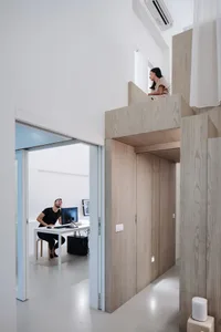 Minimalist office space featuring wooden materials.