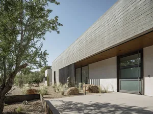 Modern house with concrete walls and a minimalist design.
