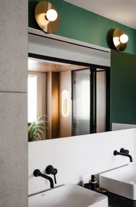 Modern bathroom with white tiled walls, concrete flooring, and black fixtures.