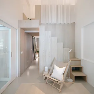 A modern minimalist residential interior featuring wood, glass, and fabric materials.