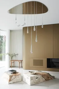 Modern minimalist living room featuring a stylish marble coffee table and abstract block accents.