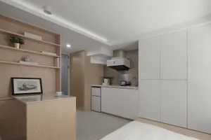 Modern apartment kitchen featuring sleek white cabinetry and minimalist design.