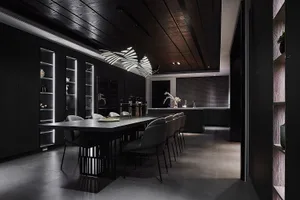 Modern black dining room featuring metallic furniture and a sleek design.