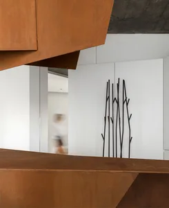 A modern interior design featuring a bronze sculpture arrangement in a sunny, open space.