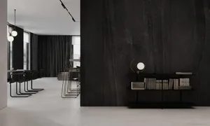 Modern living room with concrete walls and floor, minimalist furniture, and large windows.