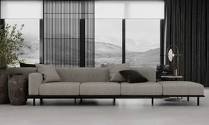 Modern living room featuring a large grey couch with black and grey throw pillows, a black floor lamp, large windows with mou