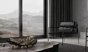 Modern minimalist bedroom featuring a wooden coffee table with spherical objects and a concrete floor.