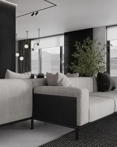 Modern living room featuring a sectional sofa upholstered in fabric and leather, with minimalist decor and large windows.