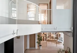 A modern living room with wooden elements and minimalist design.