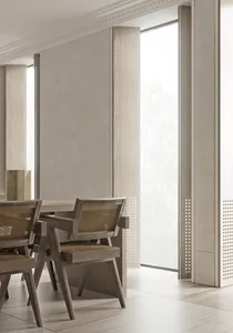 Modern dining room with minimalist design, featuring a dining table with wooden legs and a woven seat, surrounded by chairs w