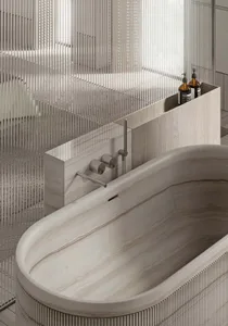 A modern bathroom with a marble bathtub, sleek design, and minimalist style.