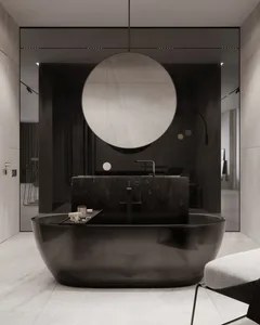 Modern bathroom with a black marble bathtub and sink.