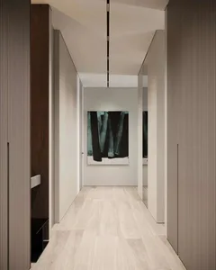 Modern corridor with white flooring and minimalist design.