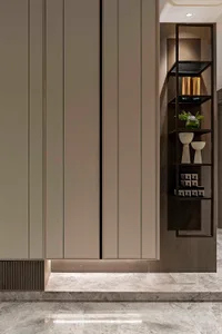 A modern minimalist storage unit with metal shelves and decorative items.