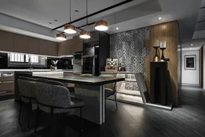 Modern residential kitchen featuring wooden countertop, stainless steel appliances, and patterned tile backsplash.