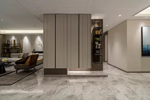 Modern living room featuring contemporary marble finishes and sleek furniture.