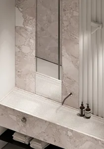 Modern minimalist bathroom with marble finishes and a sleek, contemporary design.