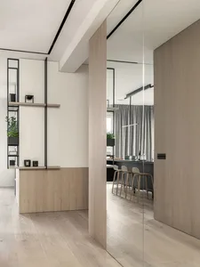 Modern kitchen with wooden cabinets and glass shelves