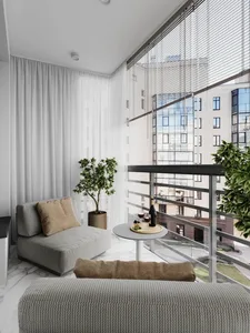 A modern living room featuring grey fabric furniture, white curtains, and potted plants.