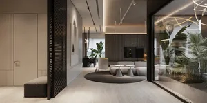 Modern living room featuring concrete and glass materials.