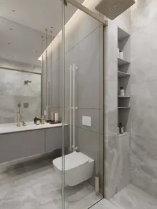 Modern bathroom with marble tiles, glass shower enclosure, and floating vanity