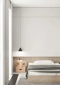 Modern minimalist bedroom with a bed, nightstand, and pendant light.