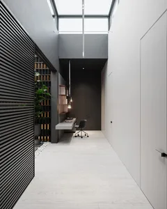 A minimalist office space featuring concrete and glass materials.