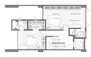 A detailed 2D architectural drawing of a modern studio apartment, featuring a bedroom, bathroom, and dressing area.