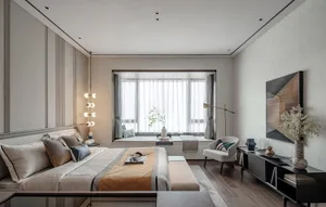 Modern, minimalist bedroom with neutral tones and a large window.