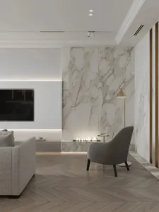 A modern minimalist living room featuring marble walls and wooden herringbone flooring.