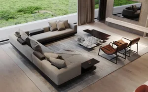 A minimalist living room featuring a large U-shaped sofa upholstered in fabric with a marble coffee table and wooden chairs.
