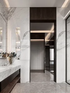 Modern bathroom featuring marble walls and flooring, minimalist design, and sleek fixtures.