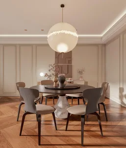 A modern dining room featuring a round wooden table with a marble base, surrounded by six contemporary chairs with upholstere