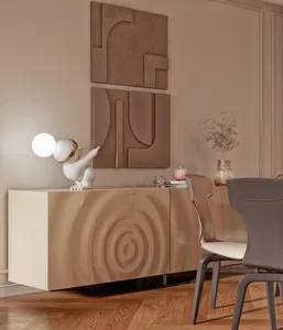 A modern dining room featuring marble furniture, glass vases, and a metal table lamp.