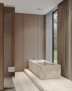 Modern minimalist bathroom featuring a marble bathtub and wooden cabinets, with a large window overlooking the outdoors.