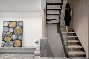A modern interior design featuring glass, concrete, and wooden elements.