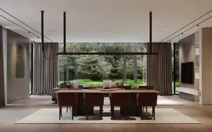Modern interior design featuring a wooden floor, large windows, and a large dining table with red chairs.